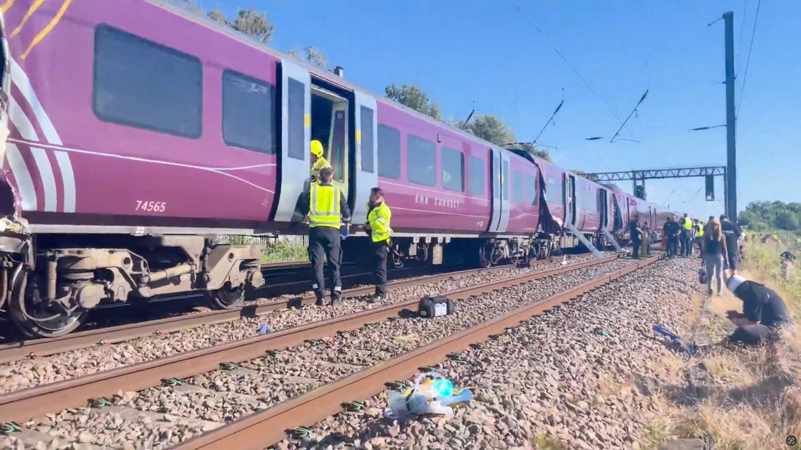 One killed and dozens injured in train collision north of London