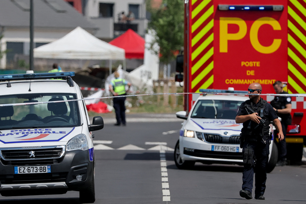 Rescuers work at the site of a plane crash in Tomblaine, France, June 28, 2026. REUTERS/Christian Hartmann