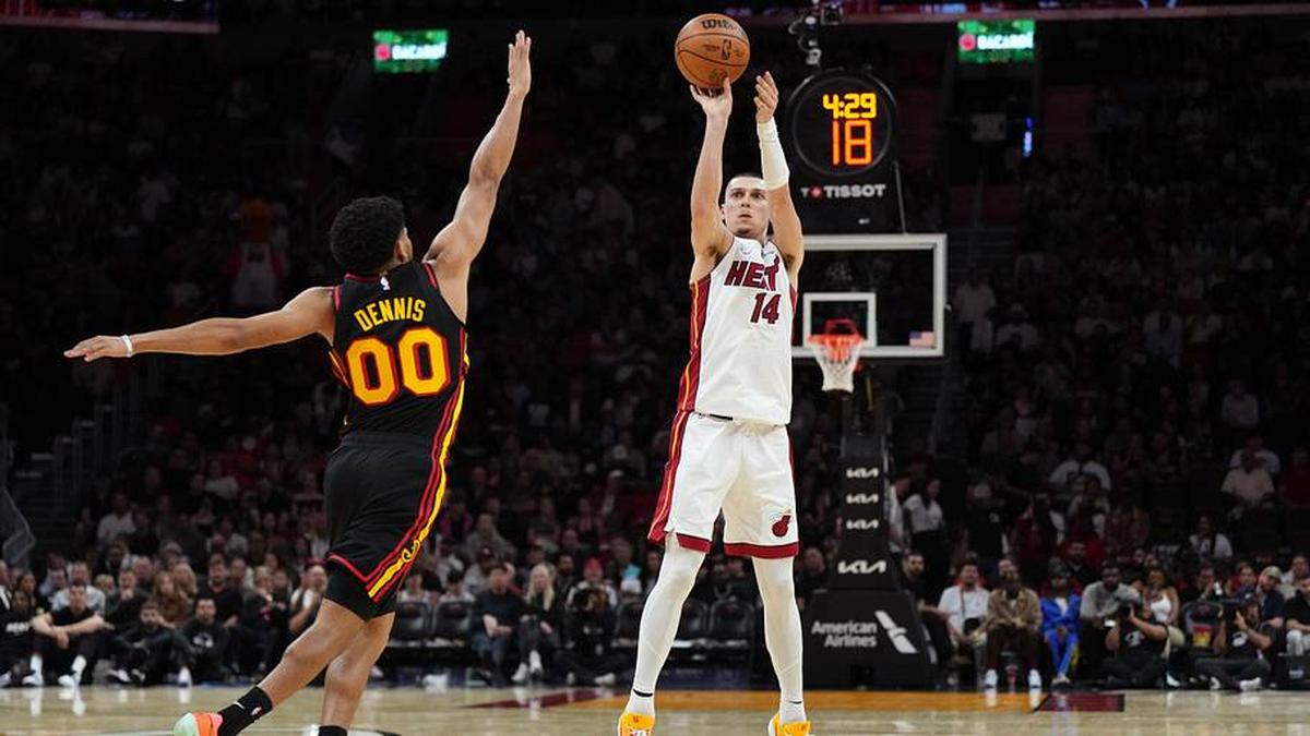  Apr 12, 2026; Miami, Florida, USA; Miami Heat guard Tyler Herro (14) shoots over Atlanta Hawks guard Rayj Dennis (00) during the second half at Kaseya Center. Mandatory Credit: Jim Rassol-Imagn Images | Jim Rassol-Imagn Images 