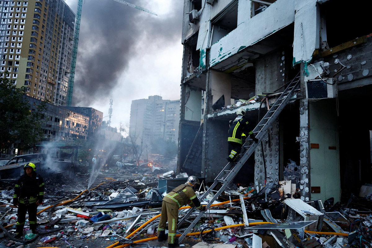 A rescuer climbs up a ladder at the site of an apartment building, which was heavily damaged during Russian missile and drone strikes, amid Russia's attack on Ukraine, in Kyiv, Ukraine, July 6, 2026. REUTERS/Valentyn Ogirenko