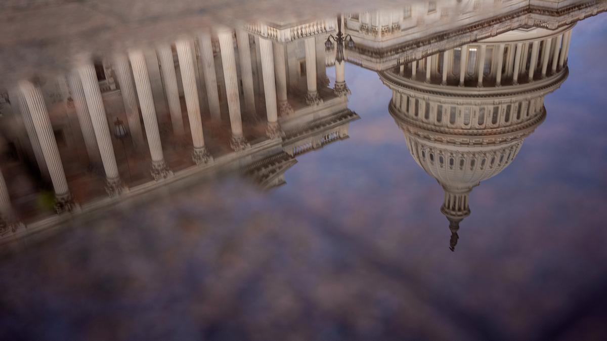 The Dome of the U.S. Capitol Building is visible in reflection on Oct. 14, 2025, in Washington, D.C.  (Andrew Harnik/Getty Images/TNS)