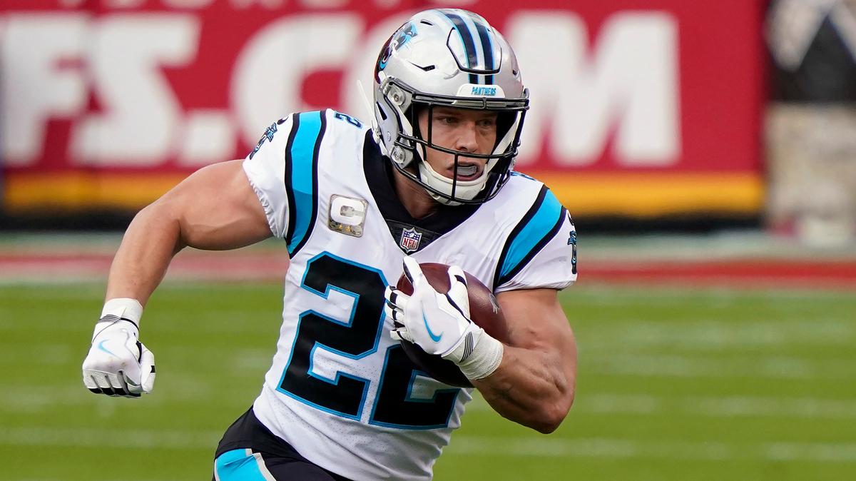 FILE - In this Nov. 8, 2020, file photo, Carolina Panthers running back Christian McCaffrey (22) carries the ball against the Kansas City Chiefs during the first half of an NFL football game in Kansas City, Mo. The Panthers have restructured the contracts of running back Christian McCaffrey and linebacker Shaq Thompson, freeing up more than $11 million in salary-cap space before the start of free agency. (AP Photo/Jeff Roberson, File)