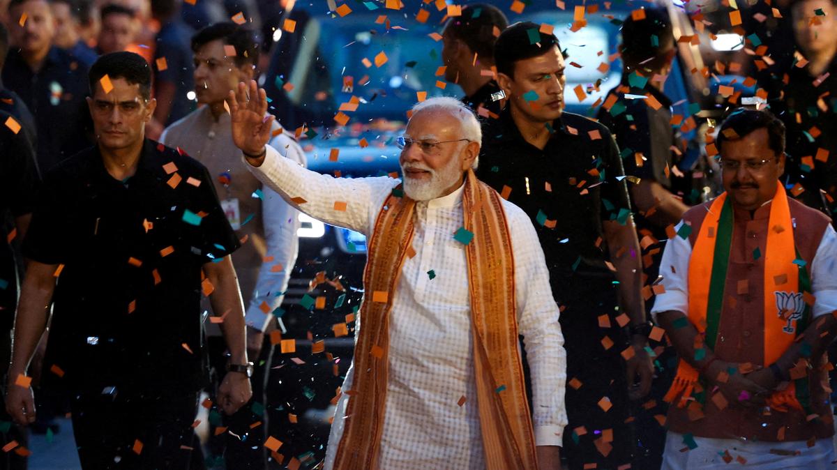 FILE PHOTO: India's Prime Minister Narendra Modi greets his supporters as he arrives at the Bharatiya Janata Party (BJP) headquarters as the BJP won the Assam state assembly election and was on course to win West Bengal, in New Delhi, India, May 4, 2026. REUTERS/Adnan Abidi/File Photo
