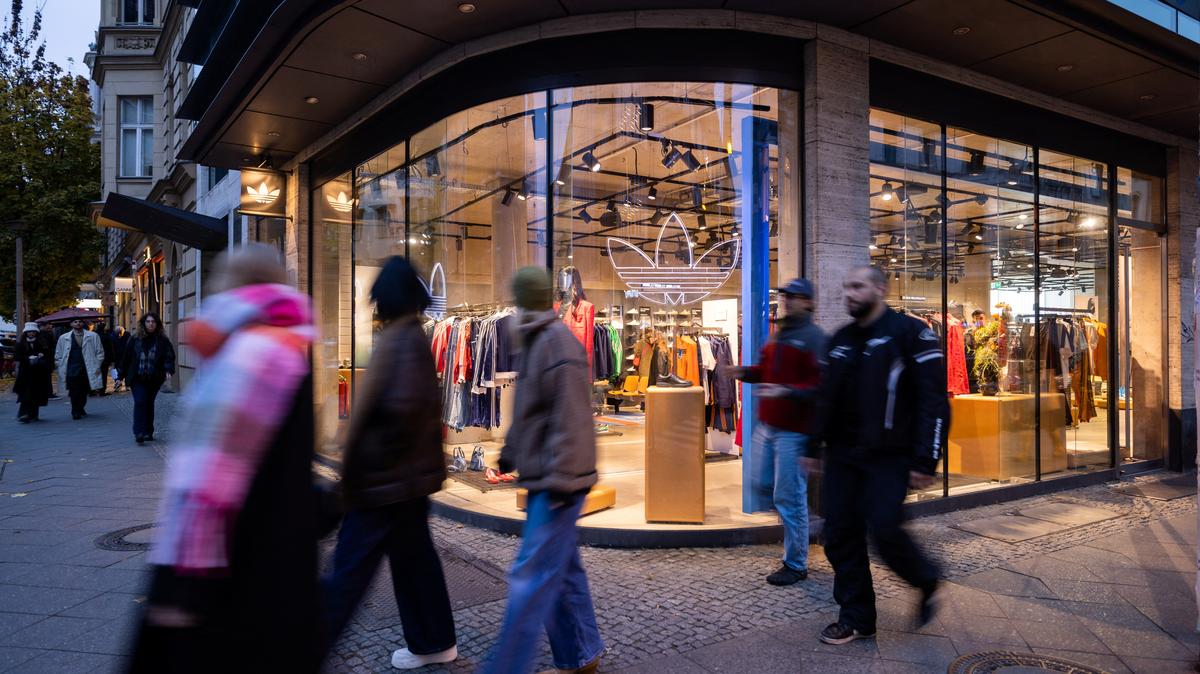 People walk past an Adidas store at Scheunenviertel quarter in Berlin, Germany, November 15, 2024. REUTERS/Lisi Niesner