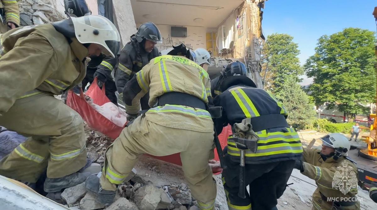 SENSITIVE MATERIAL. THIS IMAGE MAY OFFEND OR DISTURB Rescuers pull an injured person from the rubble of a destroyed dormitory building of the Starobilsk College of Luhansk Pedagogical University following an overnight attack, what Russian-installed authorities called a Ukrainian drone strike, in the course of the Russia-Ukraine conflict in the town of Starobilsk (Starobelsk) in the Luhansk region, a Russian-controlled area of Ukraine, May 22, 2026, in this still image taken from video. Russian Emergencies Ministry in Lugansk Region/Handout via REUTERS
