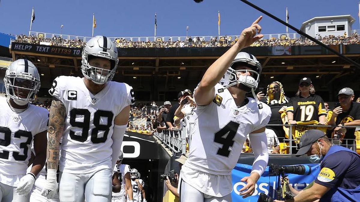  Sep 19, 2021; Pittsburgh, Pennsylvania, USA; Las Vegas Raiders running back Kenyan Drake (23) and defensive end Maxx Crosby (98) and quarterback Derek Carr (4) lead the Raiders onto the field to play the Pittsburgh Steelers at Heinz Field. Mandatory Credit: Charles LeClaire-Imagn Images | Charles LeClaire-Imagn Images 