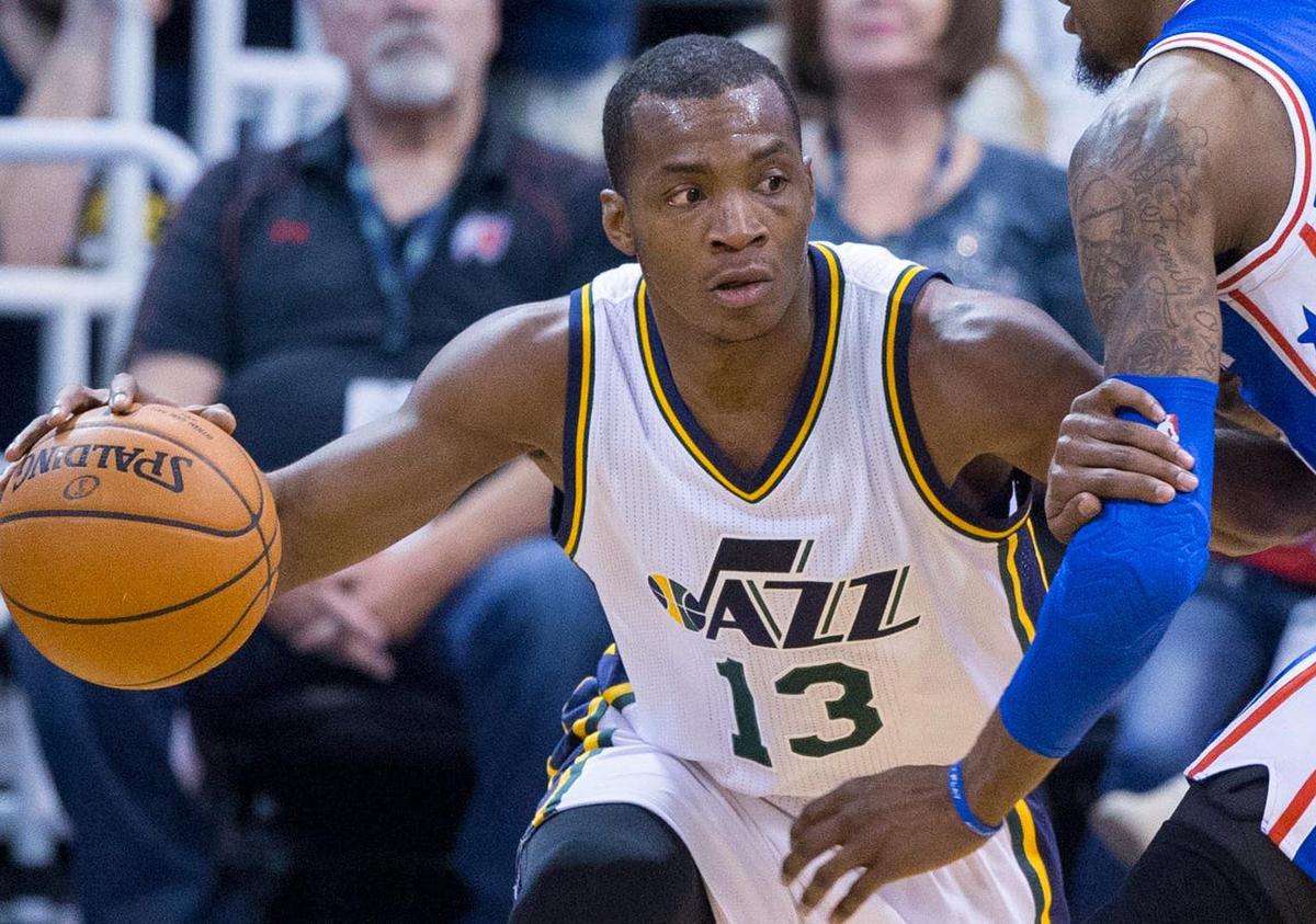Dec 28, 2015; Salt Lake City, UT, USA; Utah Jazz guard Elijah Millsap (13) dribbles the ball defended by Philadelphia 76ers forward Robert Covington (33) in NBA action at Vivint Smart Home Arena. Mandatory Credit: Rob Gray-USA TODAY Sports
