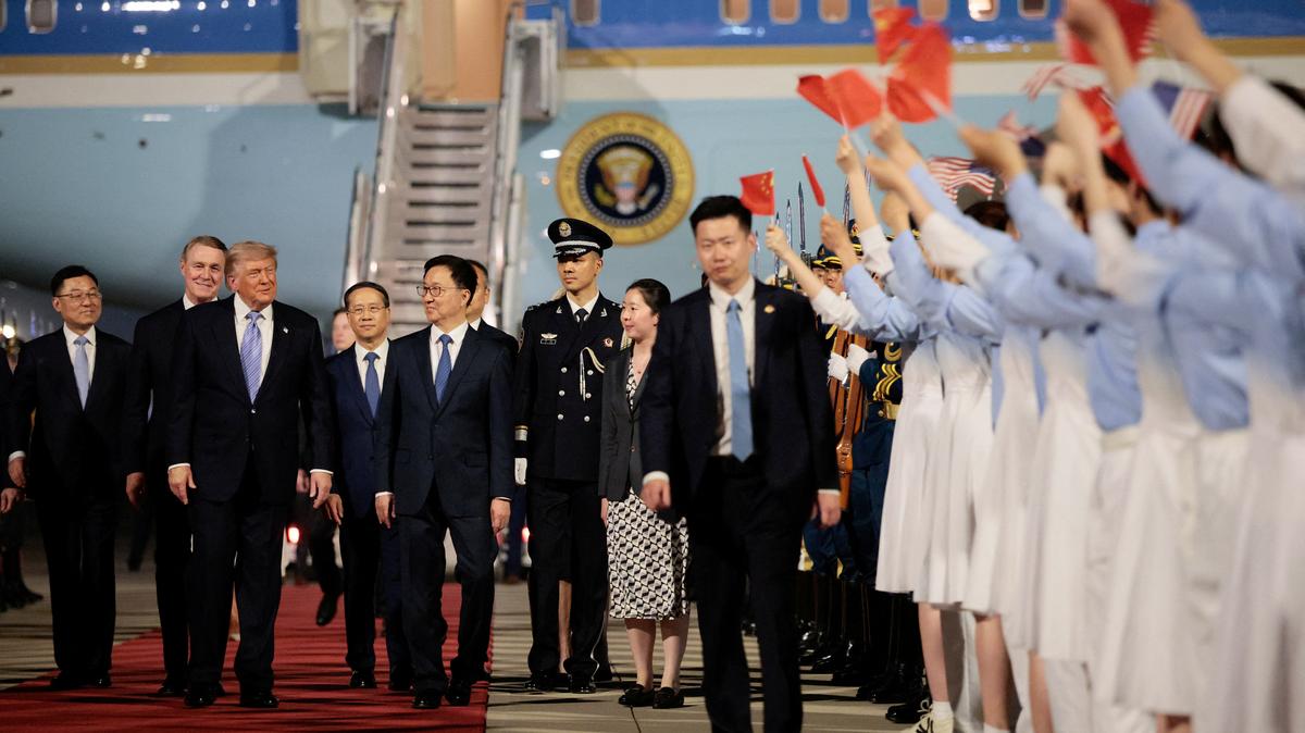 U.S. President Donald Trump walks with Chinese Vice President Han Zheng during an arrival ceremony at Beijing Capital International Airport, in Beijing, China, May 13, 2026. REUTERS/Evan Vucci