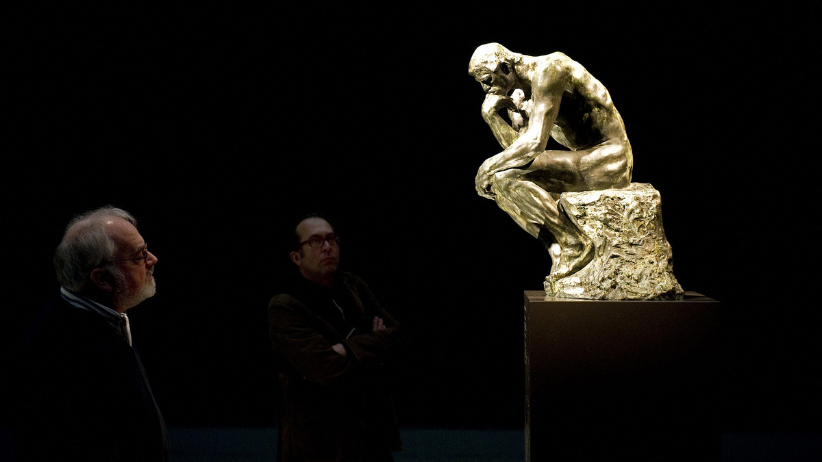Visitors look at the restored statue "The Thinker" by Auguste Rodin at the Singer Laren museum on Jan. 28, 2011. (Toussaint Kluiters/ANP/AFP/Getty Images/TNS)