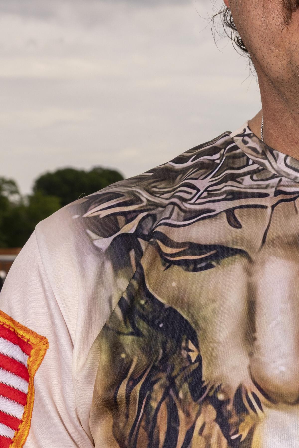 A detail of the shirt of an attendee at Rededicate 250: A National Jubilee of Prayer, Praise & Thanksgiving, in Washington on Sunday, May 17, 2026. Thousands of people gathered on the National Mall on Sunday for a daylong rally blending Christian prayer and political fervor, a gathering President Donald Trump had touted as an opportunity to "rededicate America as one nation under God." (Alex Kent/The New York Times)