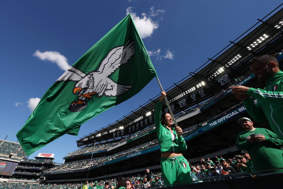  A Philadelphia Eagles fan waves a flag before the game at Lincoln Financial Field. Bill Streicher-Imagn Images