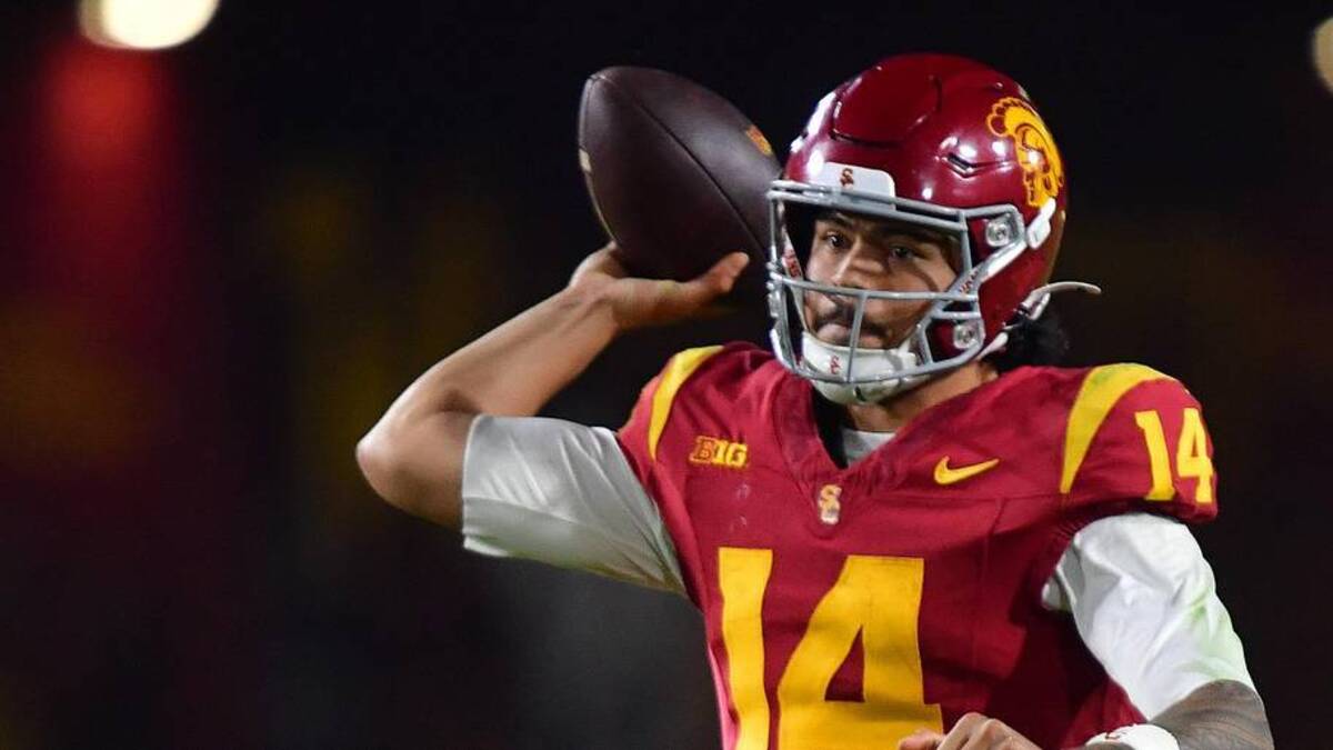  Nov 7, 2025; Los Angeles, California, USA; Southern California Trojans quarterback Jayden Maiava (14) throws against the Northwestern Wildcats during the second half at the Los Angeles Memorial Coliseum. Mandatory Credit: Gary A. Vasquez-Imagn Images | Gary A. Vasquez-Imagn Images 