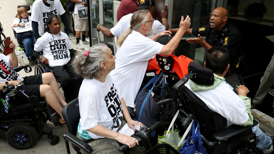 Disability advocates march on Gov. JB Pritzker's office demanding more alternatives to nursing homes 