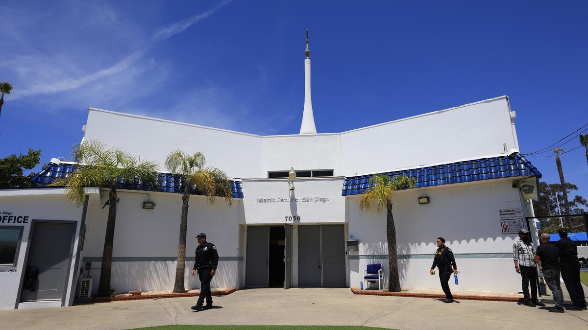 A San Diego police sergeant guards the Islamic Center of San Diego on Tuesday, May 19, 2026, the day after a shooting at the center. (K.C. Alfred/The San Diego Union-Tribune/TNS)