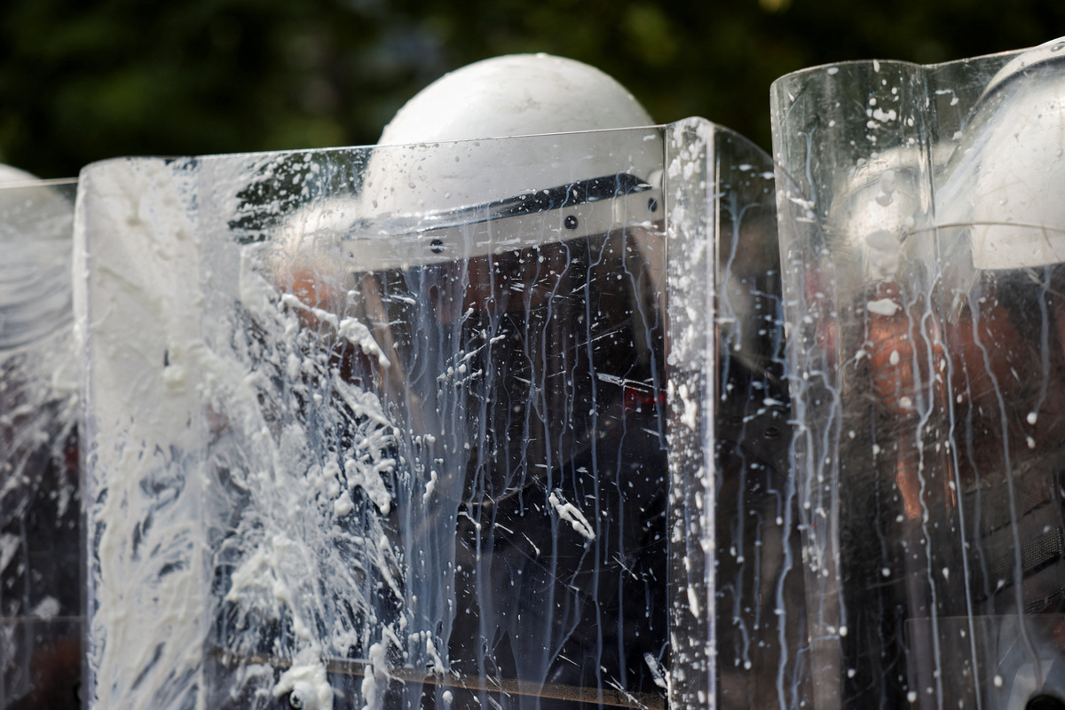 Police officers protect themselves with riot shields during a demonstration against the government, following weeks of protests against a planned luxury resort backed by a company linked to Jared Kushner, the son-in-law of U.S. President Donald Trump, on an environmentally sensitive part of the Adriatic coast, in Tirana, Albania, July 2, 2026. REUTERS/Florion Goga