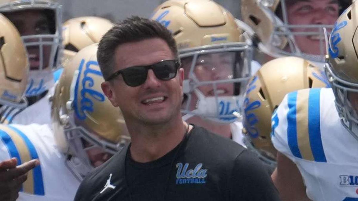  May 2, 2026; Pasadena, CA, USA; UCLA Bruins coach Bob Chesney and women's basketball coach Cori Close lead players onto the field during the spring game at Rose Bowl. Mandatory Credit: Kirby Lee-Imagn Images | Kirby Lee-Imagn Images 