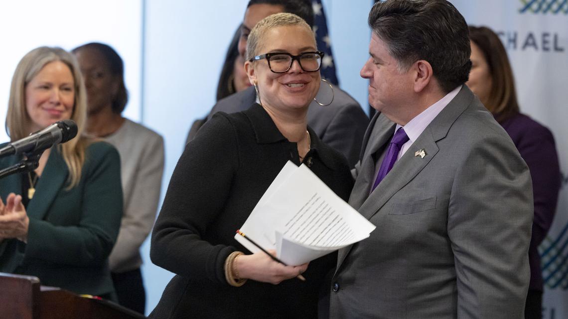Megan Jeyifo, executive director of the Chicago Abortion Fund, greets Illinois Gov. JB Pritzker on Jan. 28 during an announcement about the Prairie State Access Fund, a new initiative to strengthen reproductive and sexual health care access in Illinois.