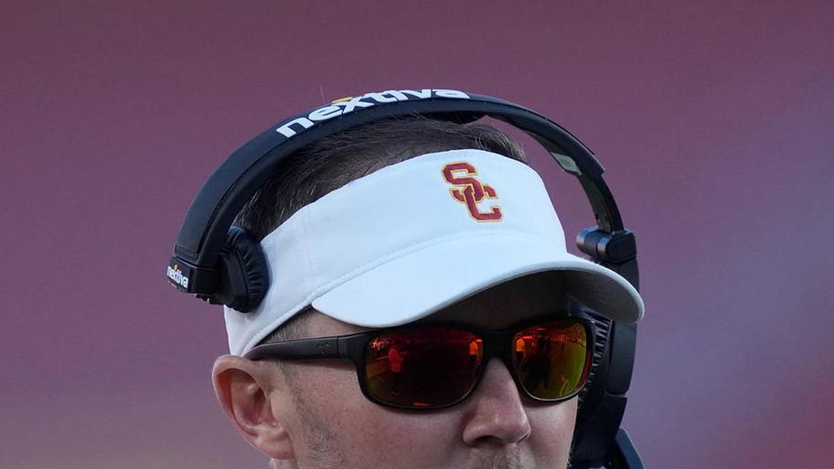  Oct 21, 2023; Los Angeles, California, USA; Southern California Trojans head coach Lincoln Riley watches from the sidelines against the Utah Utes in the first half at United Airlines Field at Los Angeles Memorial Coliseum. Mandatory Credit: Kirby Lee-Imagn Images | Kirby Lee-Imagn Images 