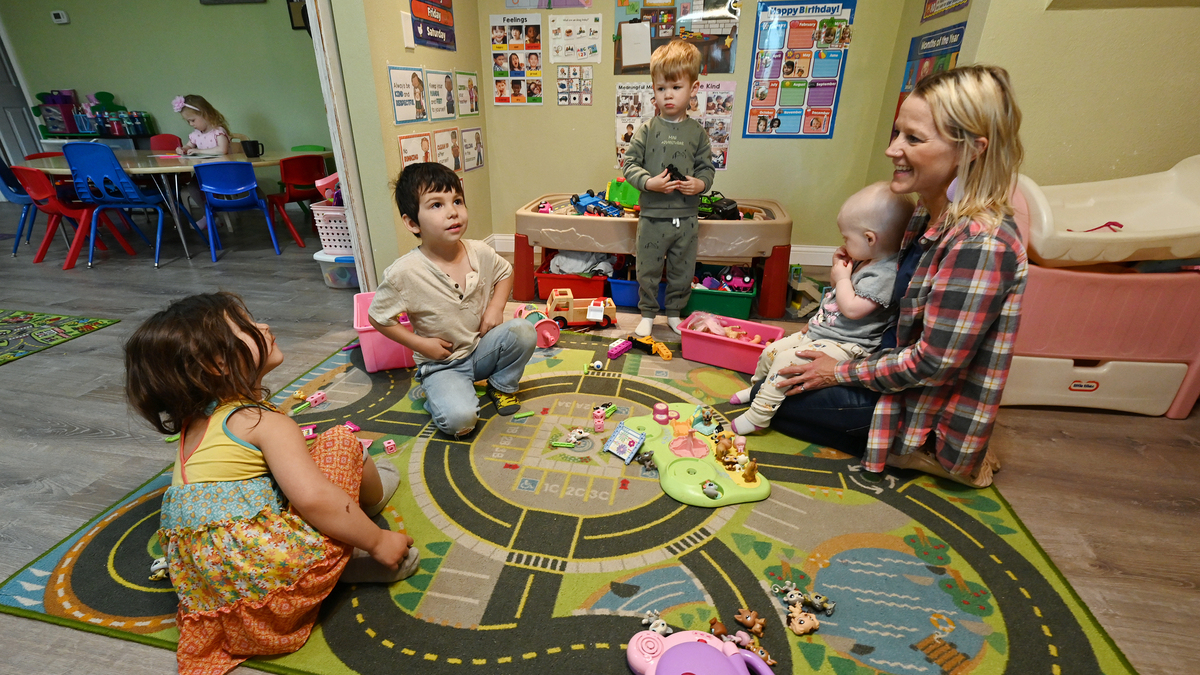 Teacher Kamie Miller interacts with students prior to their parents picking them up at Kamie's Kid Kare, a licensed in home preschool based childcare she operates off Eagle River Road, on Tuesday, June 9, 2026. (Bill Roth/Anchorage Daily News/TNS)
