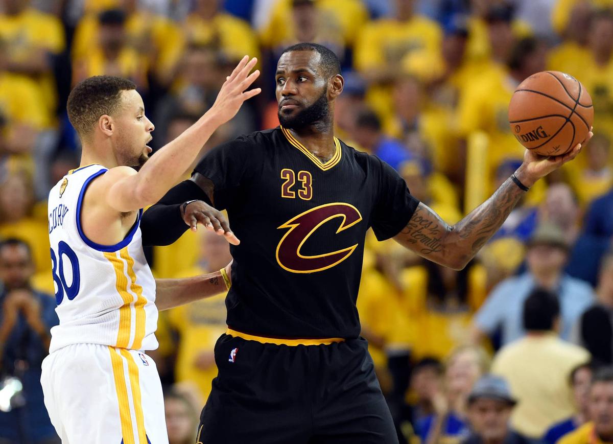  Cleveland Cavaliers forward LeBron James handles the ball against Stephen Curry in Game 7 of the NBA Finals at Oracle Arena. Bob Donnan-USA TODAY Sports