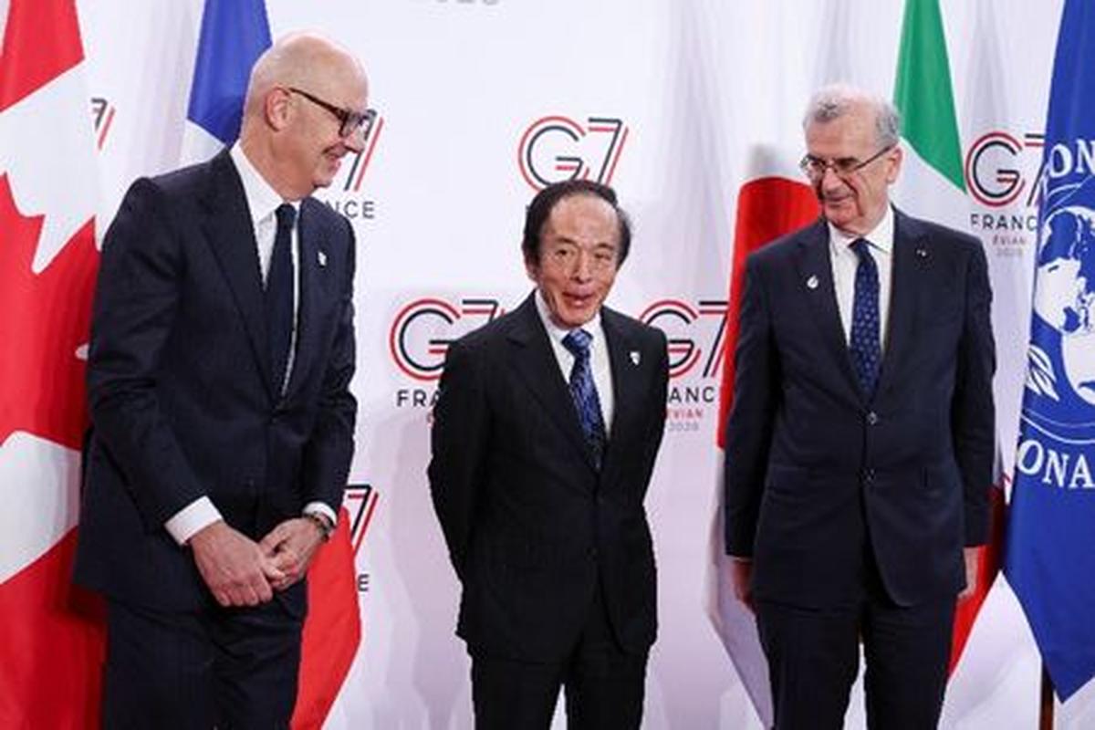 French Finance Minister Roland Lescure, Governor of the Bank of Japan Kazuo Ueda, and Governor of Banque de France Francois Villeroy de Galhau pose for a photo ahead of a G7 finance ministers and central bank governors meeting in Paris, France, May 18, 2026. REUTERS/Tom Nicholson