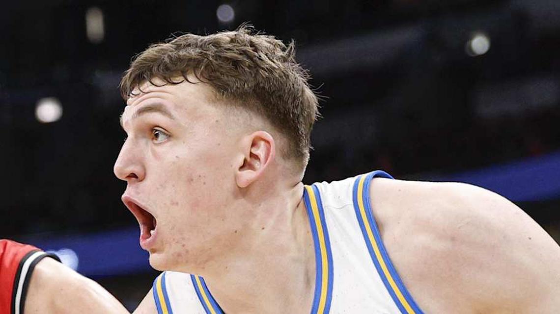  Mar 12, 2026; Chicago, IL, USA; UCLA Bruins forward Tyler Bilodeau (34) drives to the basket against Rutgers Scarlet Knights guard Harun Zrno (13) during the second half at United Center. Mandatory Credit: Kamil Krzaczynski-Imagn Images | Kamil Krzaczynski-Imagn Images 