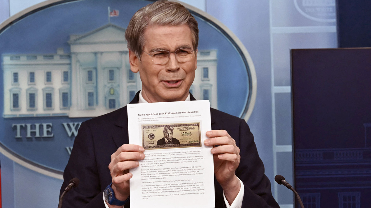 U.S. Secretary of Treasury Scott Bessent shows a proposed $250 bill featuring President Donald Trump during a news briefing in the Brady Briefing Room of the White House in Washington, D.C., on Thursday, May 28, 2026. While that bill has yet to appear, Bessent did recently announce that U.S. dollar-denominated bills featuring President Donald Trump’s signature were being introduced to commemorate the nation’s 250th birthday. (Kent Nishimura/AFP/Getty Images/TNS)