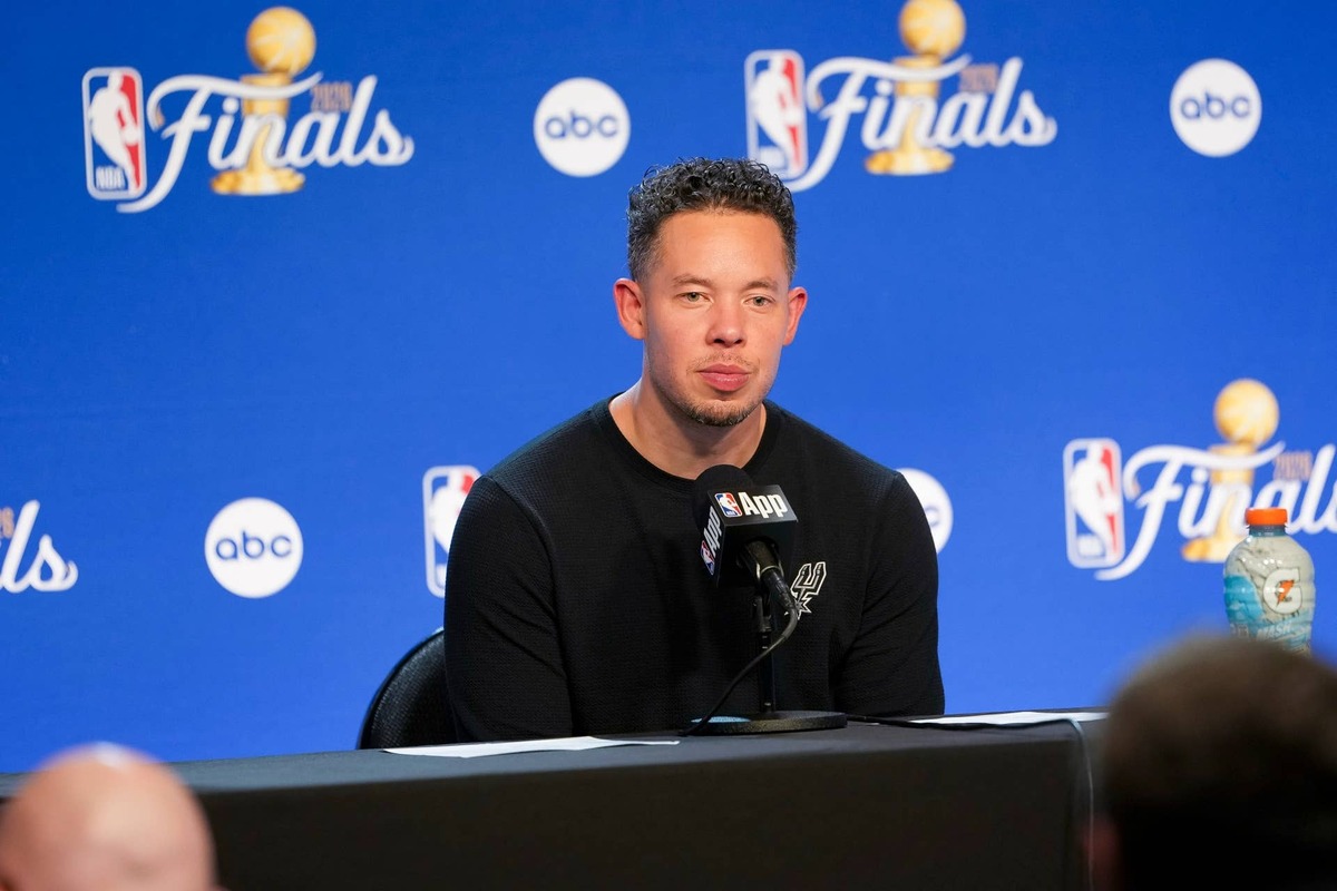  Jun 5, 2026; San Antonio, Texas, USA; San Antonio Spurs head coach Mitch Johnson speaks with the media after the game between the Spurs and the Knicks in game two of the 2026 NBA Finals at Frost Bank Center. Mandatory Credit: Daniel Dunn-Imagn Images 