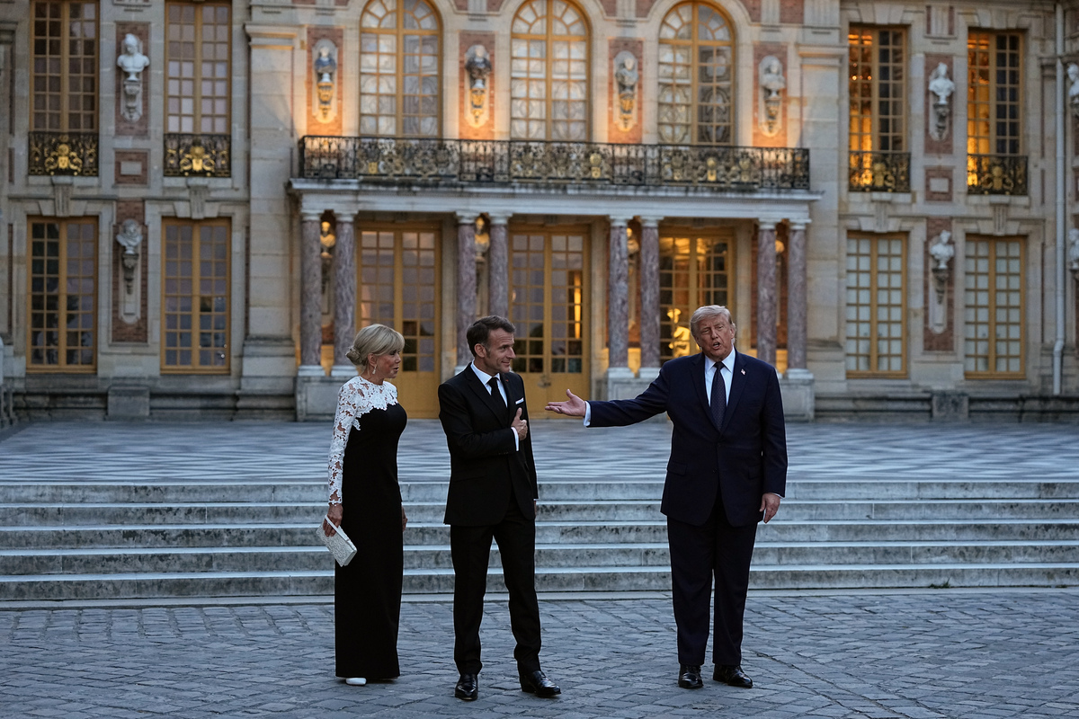 President Donald Trump is welcomed to the Palace of Versailles by President Emmanuel Macon of France and first lady Brigitte Macron in Versailles, France, on Wednesday evening, June 17, 2026. (Haiyun Jiang/The New York Times)