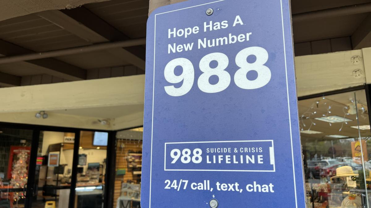 Sign for the 988 Lifeline mental health emergency hotline, in California in 2024. Children and teens must seek parental consent to use the Idaho 988 Crisis and Suicide Hotline after a new law took effect, Idaho 988’s director said. 