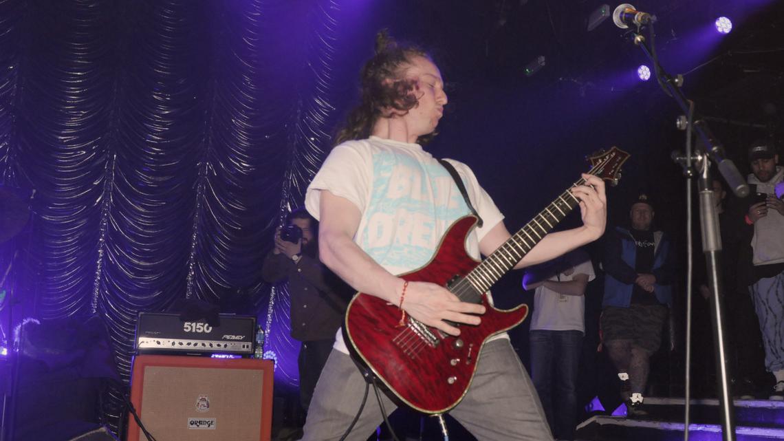 Grammy-Winning Band's Founding Guitarist Arrested on Second-Degree Murder Charges: Report 