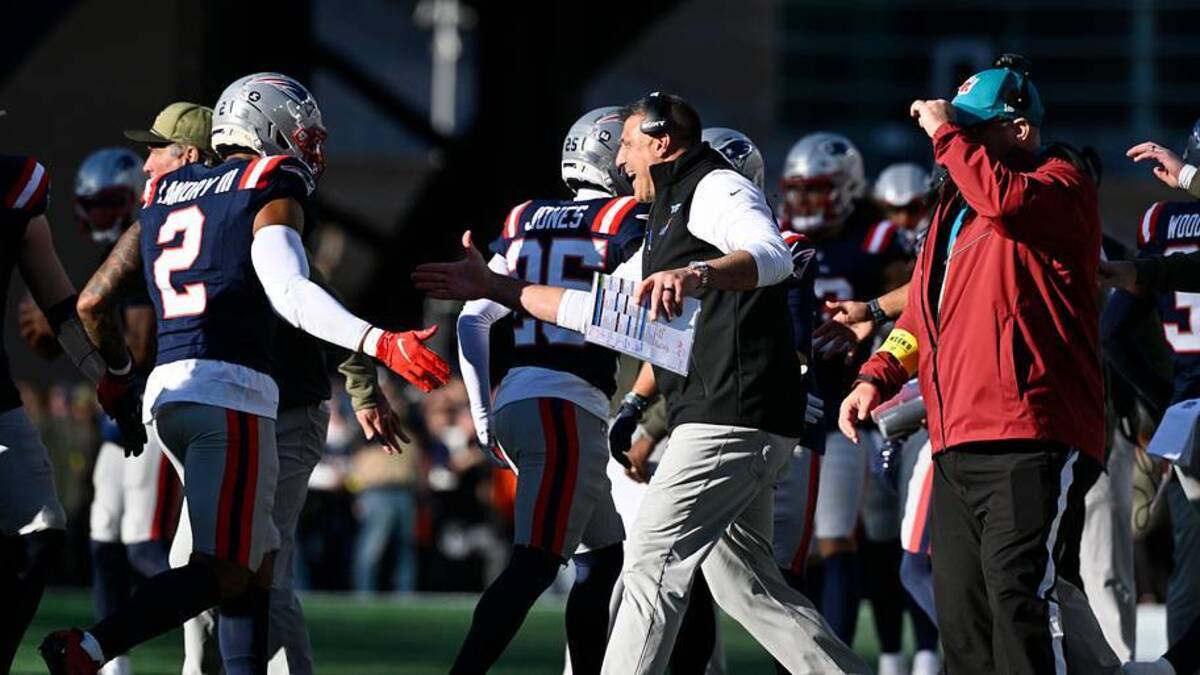  Nov 2, 2025; Foxborough, Massachusetts, USA; New England Patriots head coach Mike Vrabel high fives linebacker Harold Landry III (2) during the first half against the Atlanta Falcons at Gillette Stadium. Mandatory Credit: Eric Canha-Imagn Images | IMAGN IMAGES via Reuters Connect 