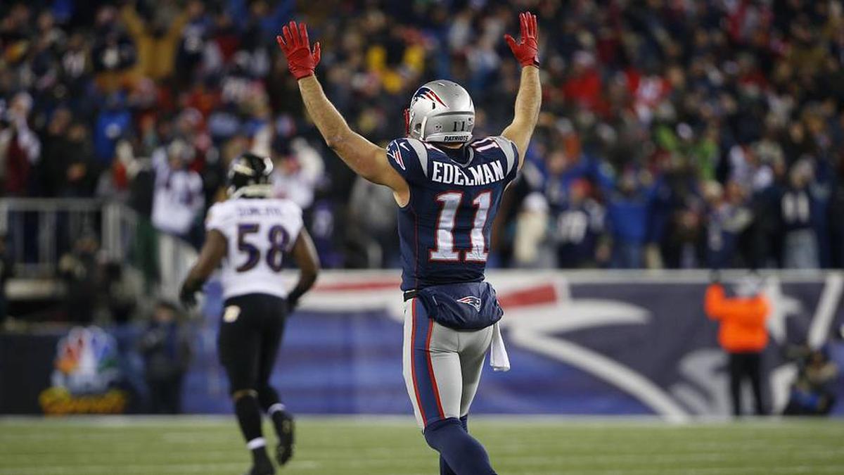  Jan 10, 2015; Foxborough, MA, USA; New England Patriots wide receiver Julian Edelman (11) celebrates after throwing a touchdown pass during the fourth quarter against the Baltimore Ravens in the 2014 AFC Divisional playoff football game at Gillette Stadium. The Patriots won 35-31. Mandatory Credit: Winslow Townson-Imagn Images | Winslow Townson-Imagn Images 