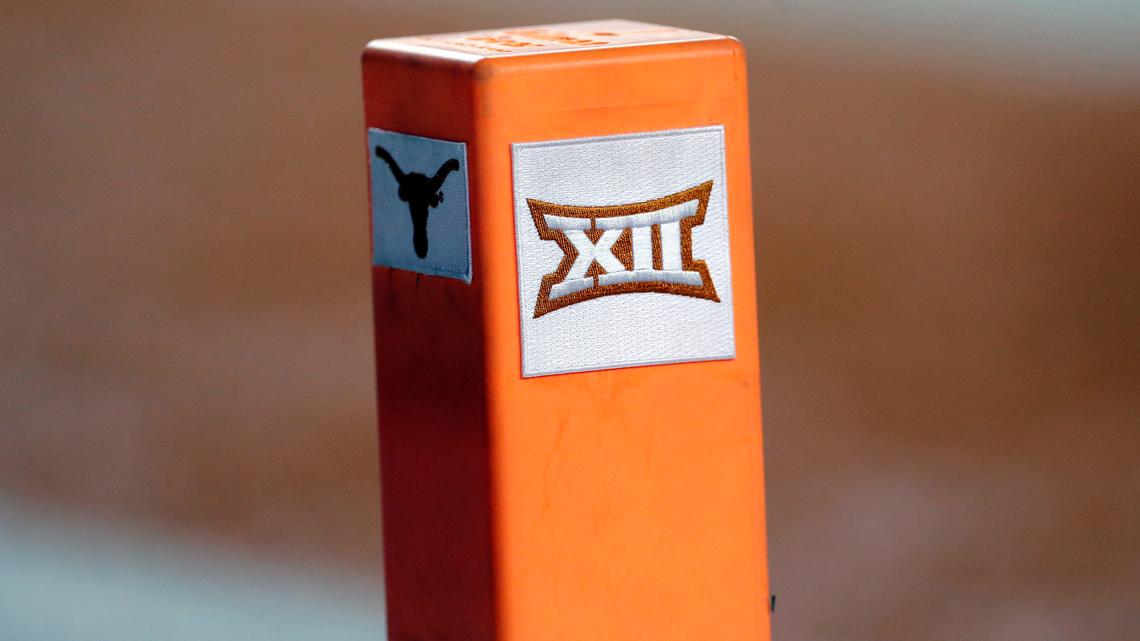FILE - In this Sept. 15, 2018, file photo, the Big 12 conference logo is seen on a pylon during the first half of an NCAA college football game between Texas and USC in Austin, Texas. Texas and Oklahoma made a request Tuesday, July 27, 2021, to join the Southeastern Conference — in 2025 —- with SEC Commissioner Greg Sankey saying the league would consider it in the “near future.” (AP Photo/Eric Gay, File)