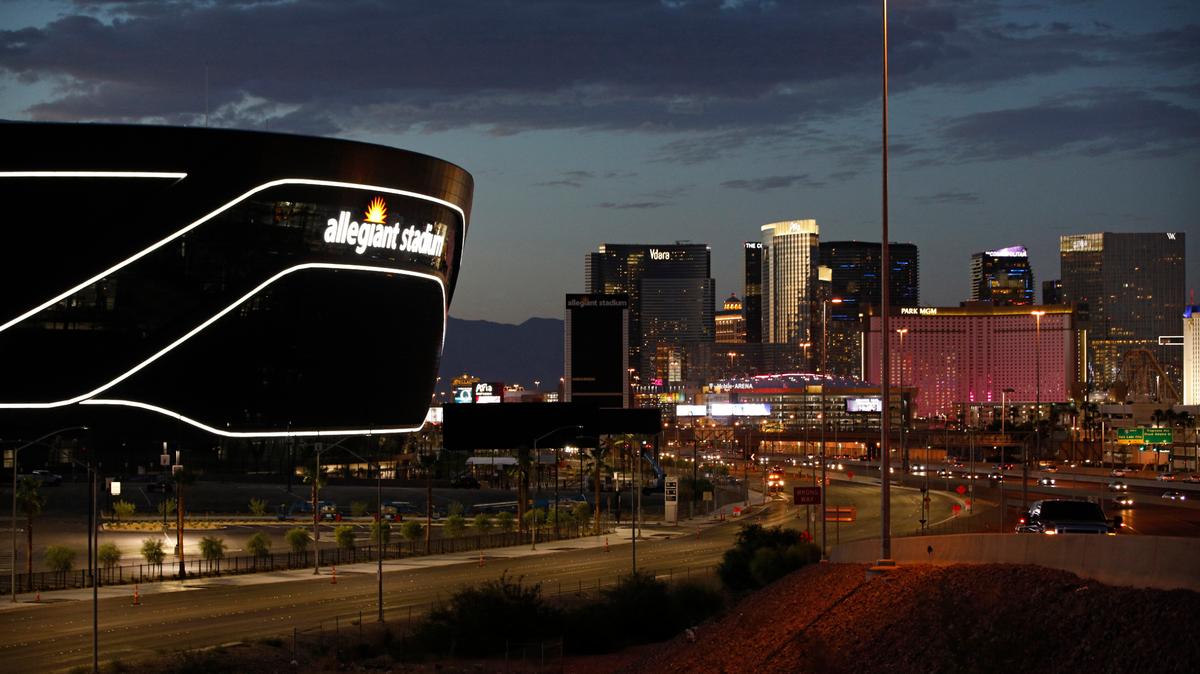 Lights adorn Allegiant Stadium, new home of the Las Vegas Raiders football team, as it nears completion Wednesday, July 22, 2020, in Las Vegas. The stadium will also serve as the home for the UNLV football team. (AP Photo/John Locher)