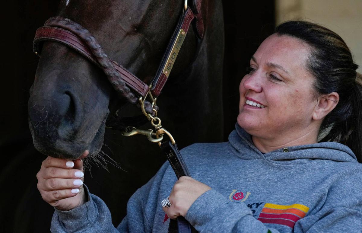  Cherie DeVaux pets Golden Tempo the day after winning the 152nd running of the Kentucky Derby at Churchill Downs on Sunday, May 3, 2026. 