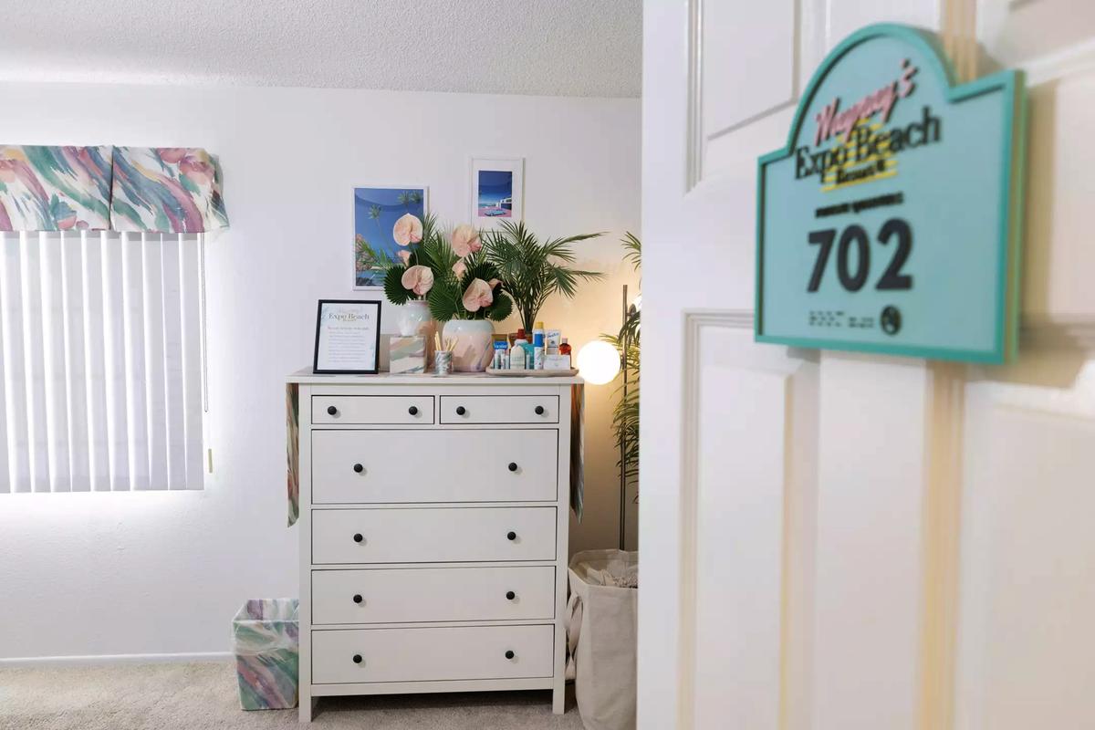 A hotel room sign welcomes you to the Expo Beach Resort.