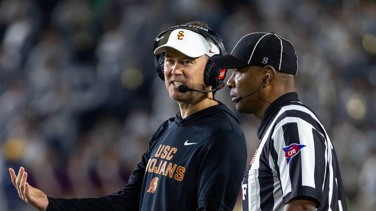  Oct 18, 2025; South Bend, Indiana, USA; Southern California Trojans head coach Lincoln Riley talks to an official during the first half against the Notre Dame Fighting Irish at Notre Dame Stadium. Mandatory Credit: Michael Caterina-Imagn Images | Michael Caterina-Imagn Images 