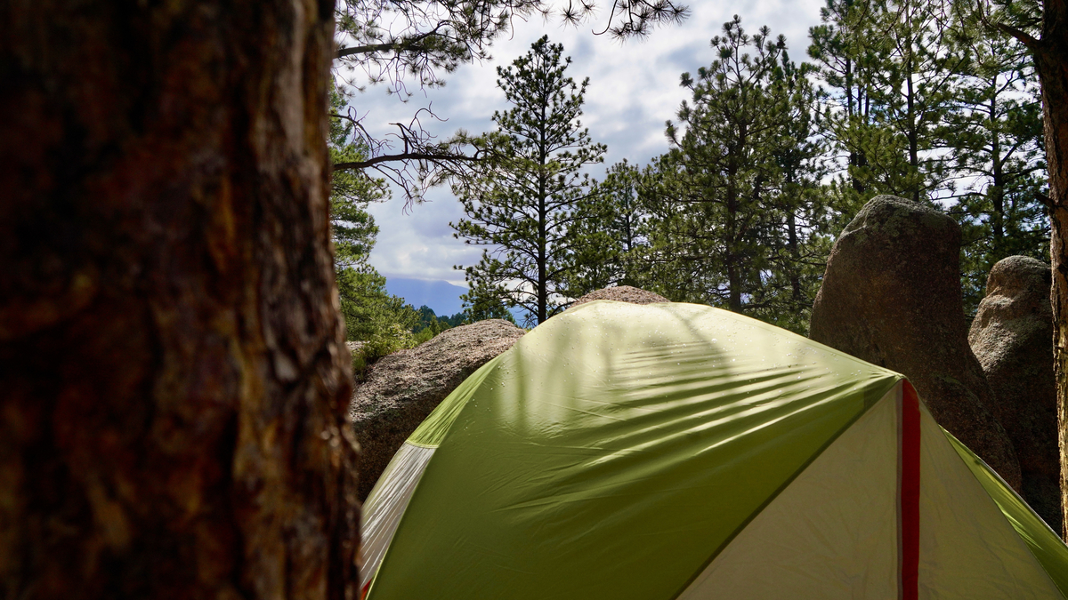The view of the mountains above a tent at the guys' campsite near Buffalo Creek Campground near Bailey, Colorado on July 16, 2024. (Zachary Spindler-Krage/The Denver Post/TNS)