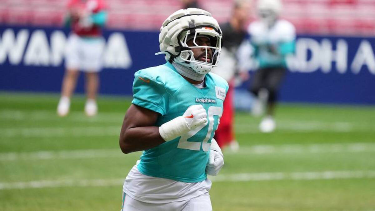  Nov 14, 2025; Madrid, Spain; Miami Dolphins linebacker Jordyn Brooks (20) wears a Guardian helmet cap during practice at Estadio Riyadh Air Metropolitano. Mandatory Credit: Kirby Lee-Imagn Images | IMAGN IMAGES via Reuters Connect 