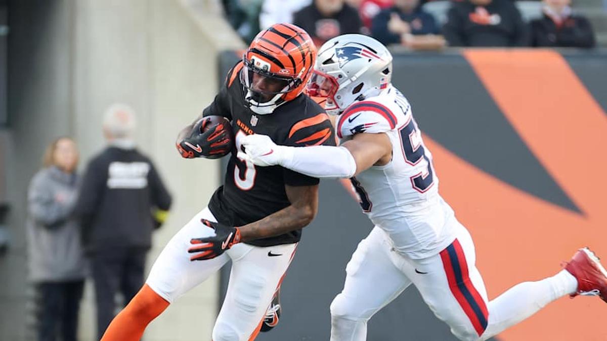  Nov 23, 2025; Cincinnati, Ohio, USA; Cincinnati Bengals wide receiver Tee Higgins (5) runs against New England Patriots linebacker Christian Elliss (53) during the second half at Paycor Stadium. Mandatory Credit: Joseph Maiorana-Imagn Images | Joseph Maiorana-Imagn Images 