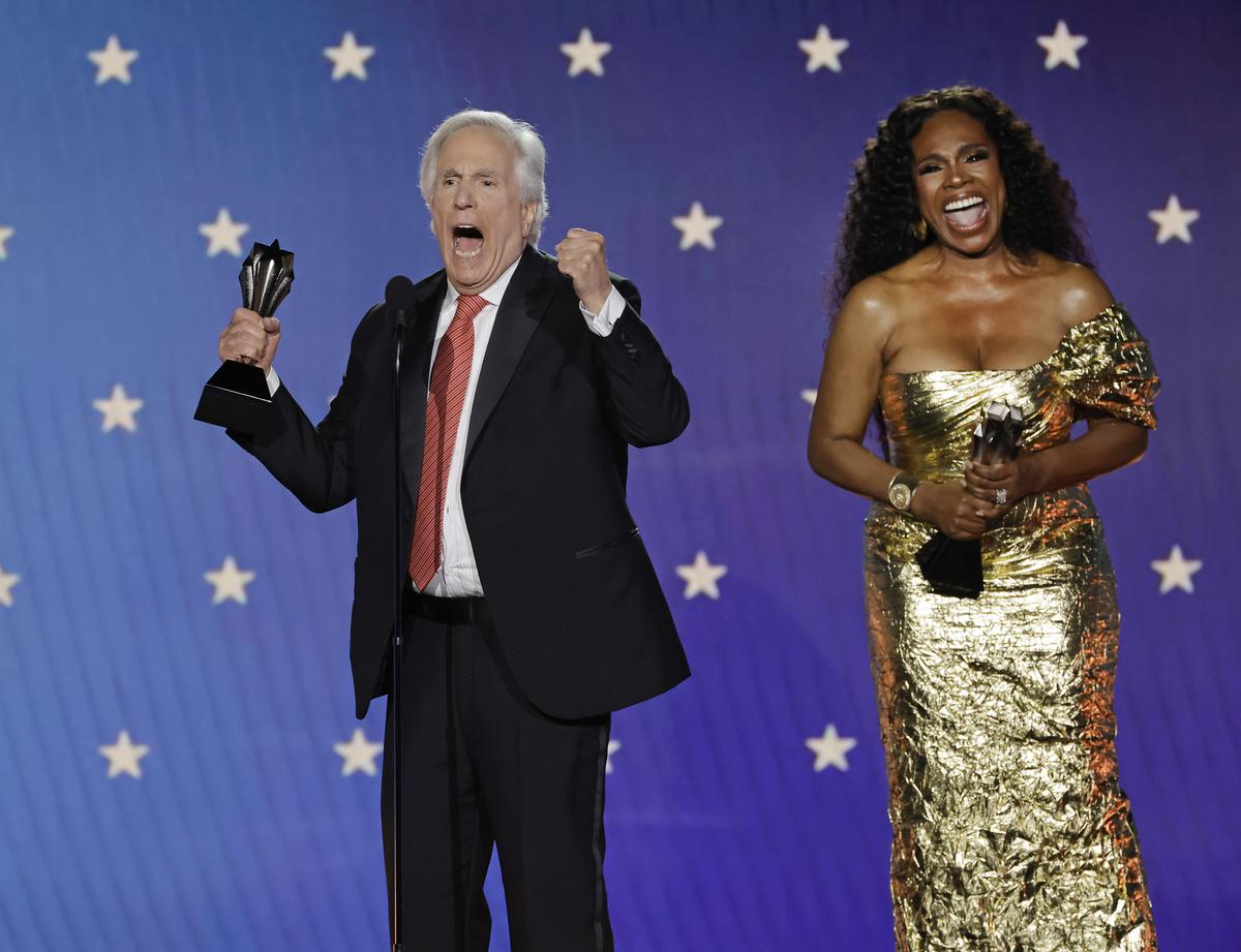 Henry Winkler accepts his Critics Choice Award in 2023 from Sheryl Lee RalphGetty