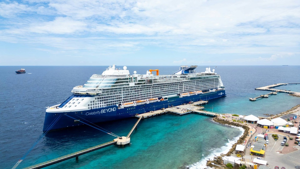 Luxurious cruise ship, Celebrity Beyond docked at a vibrant port in Curaçao.. 