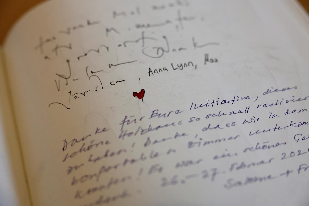 A detail of the guest book of the newly built Momentum Lodge, at the Lauchernalp in Wiler, nearly a year after a massive rock and ice slide triggered by the collapse of the Birch Glacier destroyed much of the village of Blatten, Switzerland, May 20, 2026.  REUTERS/Stefan Wermuth