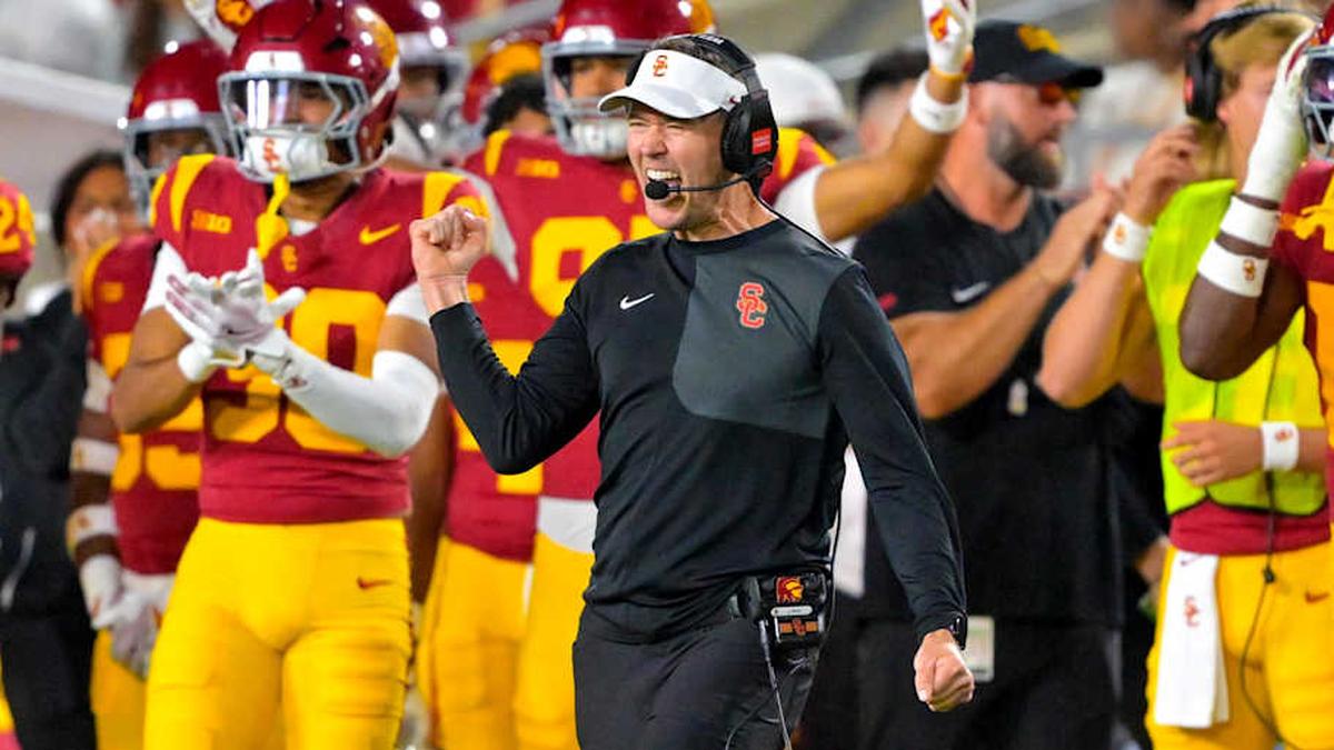  Oct 11, 2025; Los Angeles, California, USA; USC Trojans head coach Lincoln Riley celebrates after kicker Ryon Sayeri (48) hit a 54-yard field goal in the second half against the Michigan Wolverines at United Airlines Field at the Los Angeles Memorial Coliseum. Mandatory Credit: Jayne Kamin-Oncea-Imagn Images | Jayne Kamin-Oncea-Imagn Images 