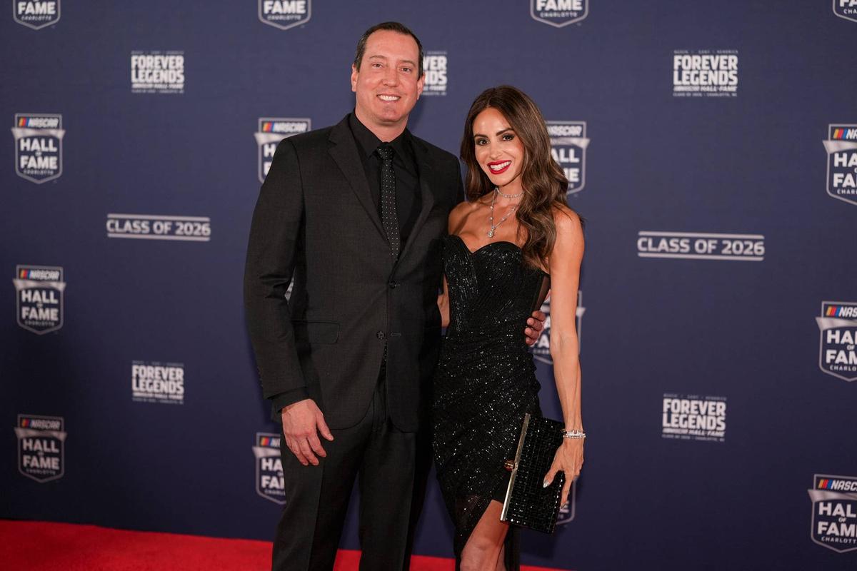  Jan 23, 2026; Charlotte, NC, USA; Kyle Busch and his wife Samantha pose on the red carpet during the NASCAR Hall of Fame Induction at Charlotte Convention Center - Crown Ballroom. Mandatory Credit: Jim Dedmon-Imagn Images 