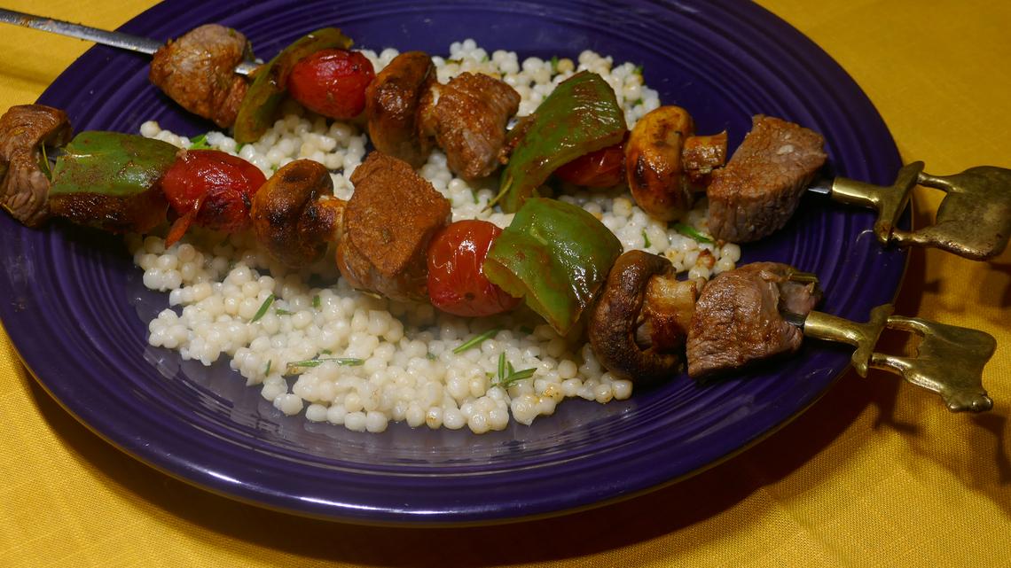 Beef kabobs and pearl couscous.
