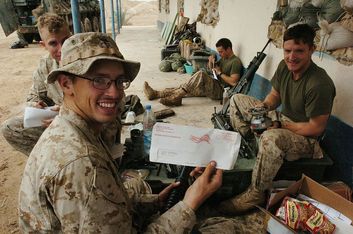  U.S. Marines in Iraq hold voting materials received by mail in 2004. Overseas voters often mail ballots weeks before Election Day to meet deadlines. Scott Peterson/Getty Images 