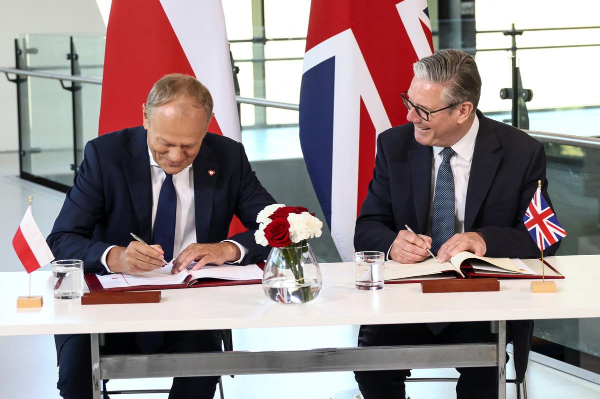Britain's Prime Minister Keir Starmer and Poland's Prime Minister Donald Tusk attend a signing ceremony of a UK-Poland defence and security treaty at the Battle of Britain Bunker in Uxbridge, Britain, May 27, 2026. REUTERS/Jack Taylor/Pool