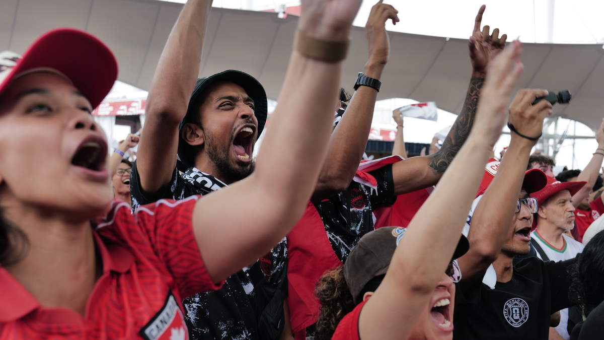Canada fans cheer during their World Cup round of 16 match with Morocco, at a watch party in Toronto on Saturday.